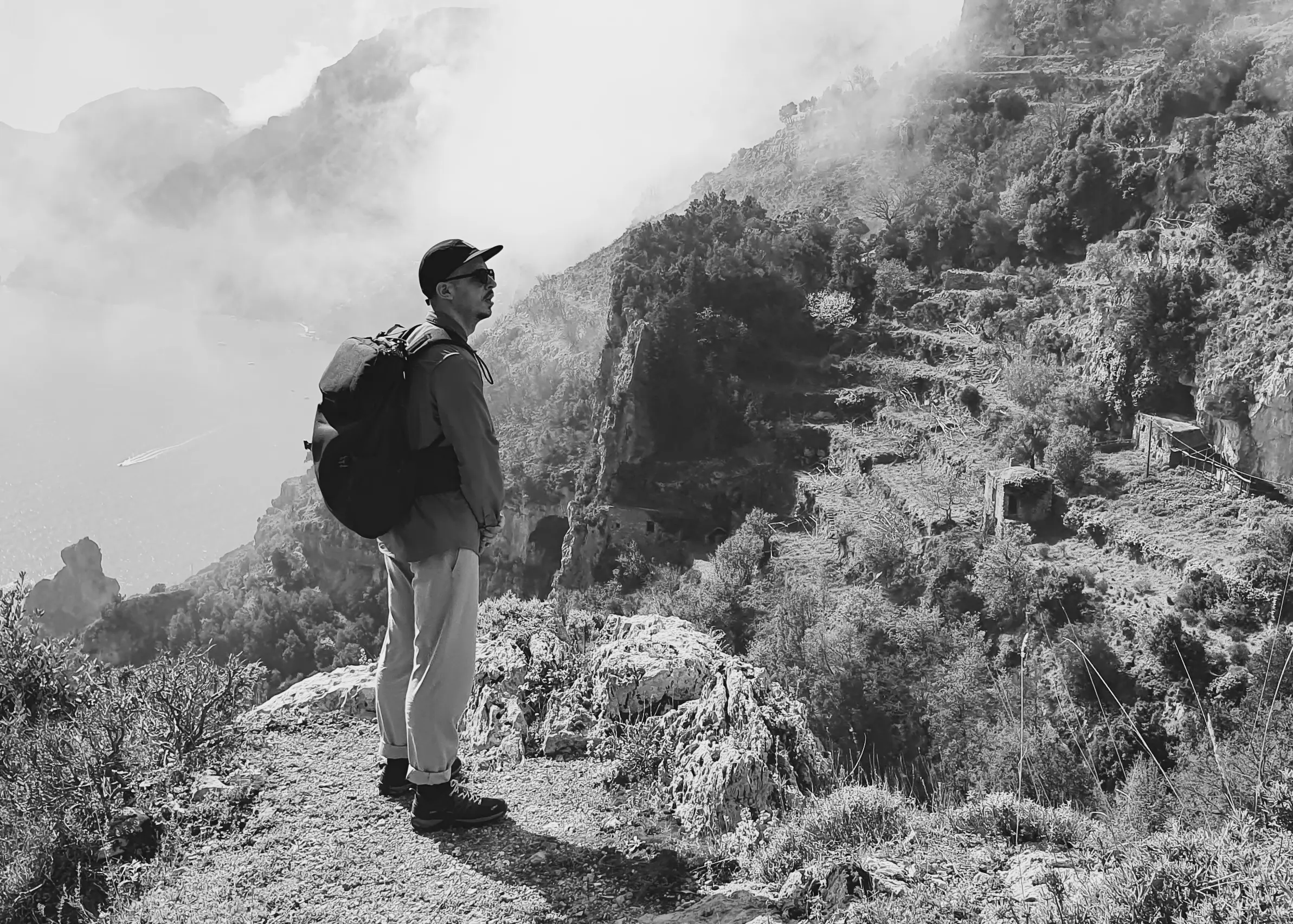 Rob standing on a cliff overlooking the sea.